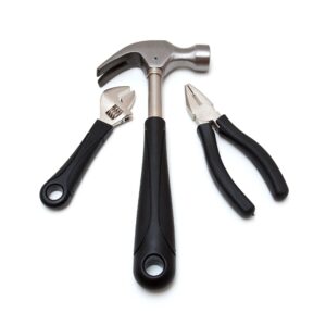 Spray gun cleaning kit items on a clean background (brushes, needles, lubricant)